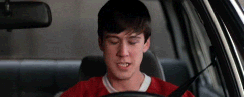 Cameron Frye from the movie Ferris Bueller's Day Off screaming and punching seat while inside a car.